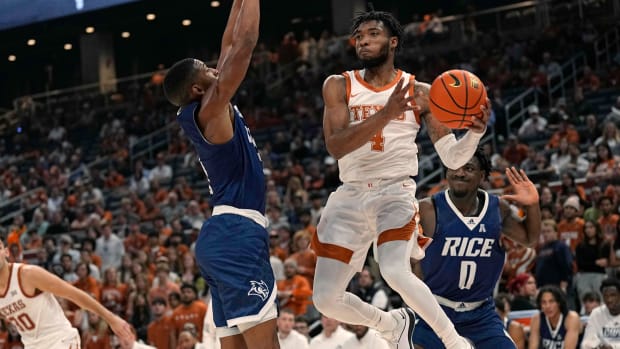 Texas Longhorns guard Tyrese Hunter (4) passes the ball around Rice Owls guard Travis Evee (3) during the first half at Moody Center.